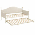 Cama nido de madera con cabecero tapizado en beige