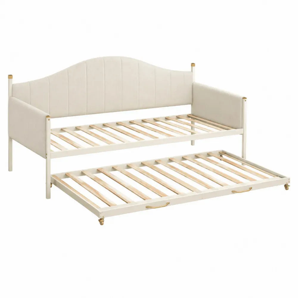 Cama nido de madera con cabecero tapizado en beige